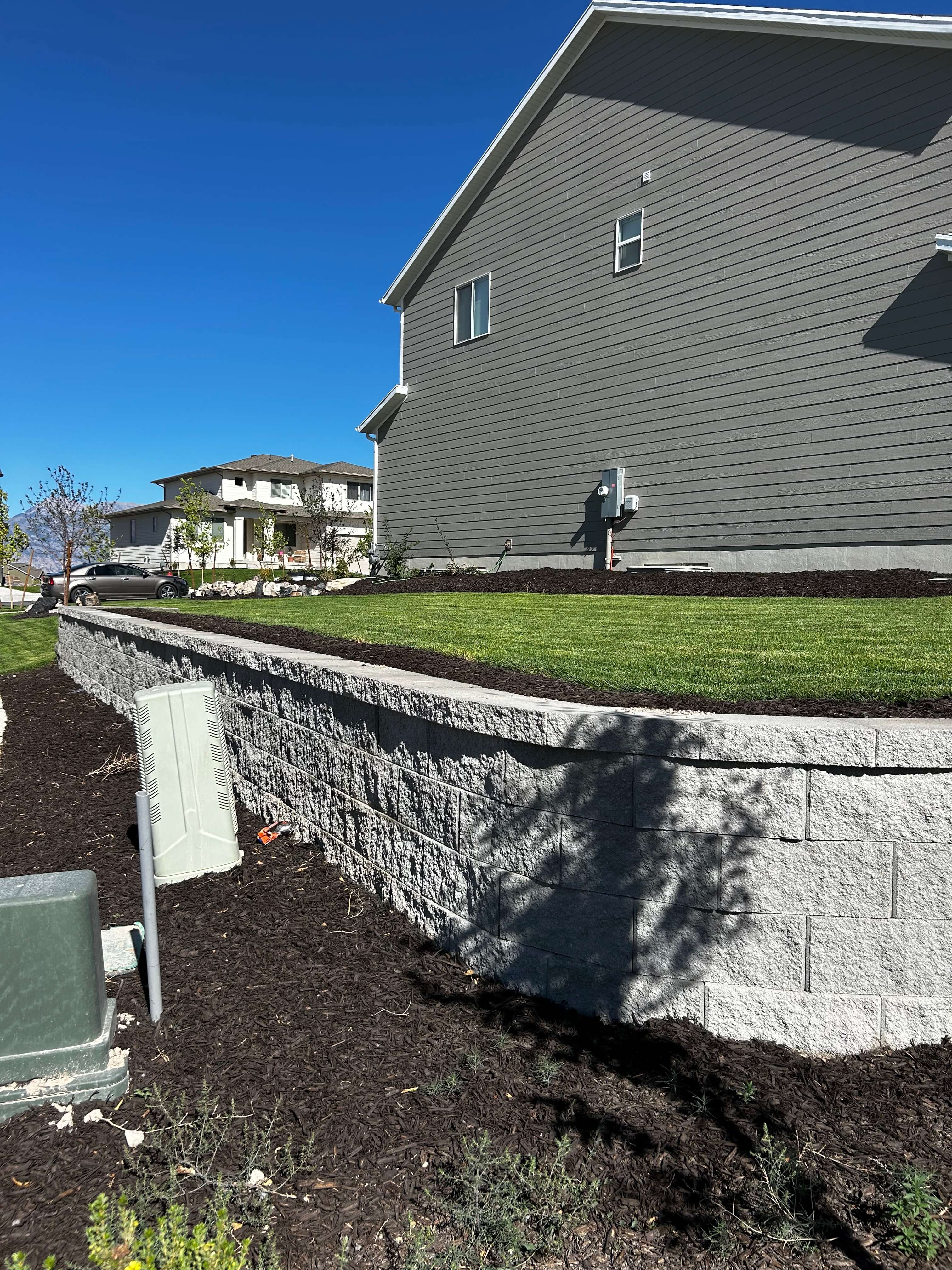 Custom landscaping project with hardscapes, design, and outdoor living features